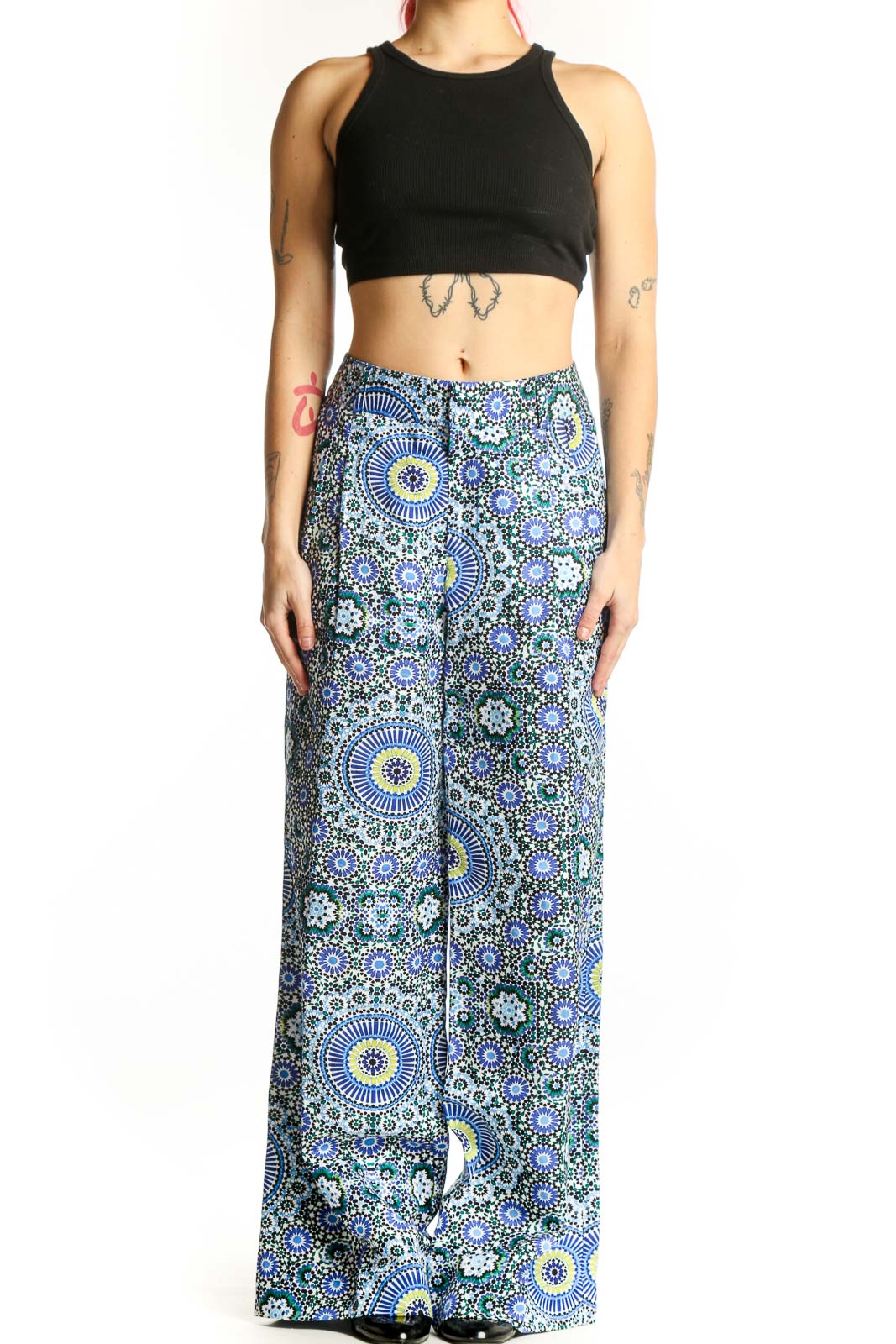 Front view of blue geometric floral wide-leg linen pants with sunburst and circular motifs