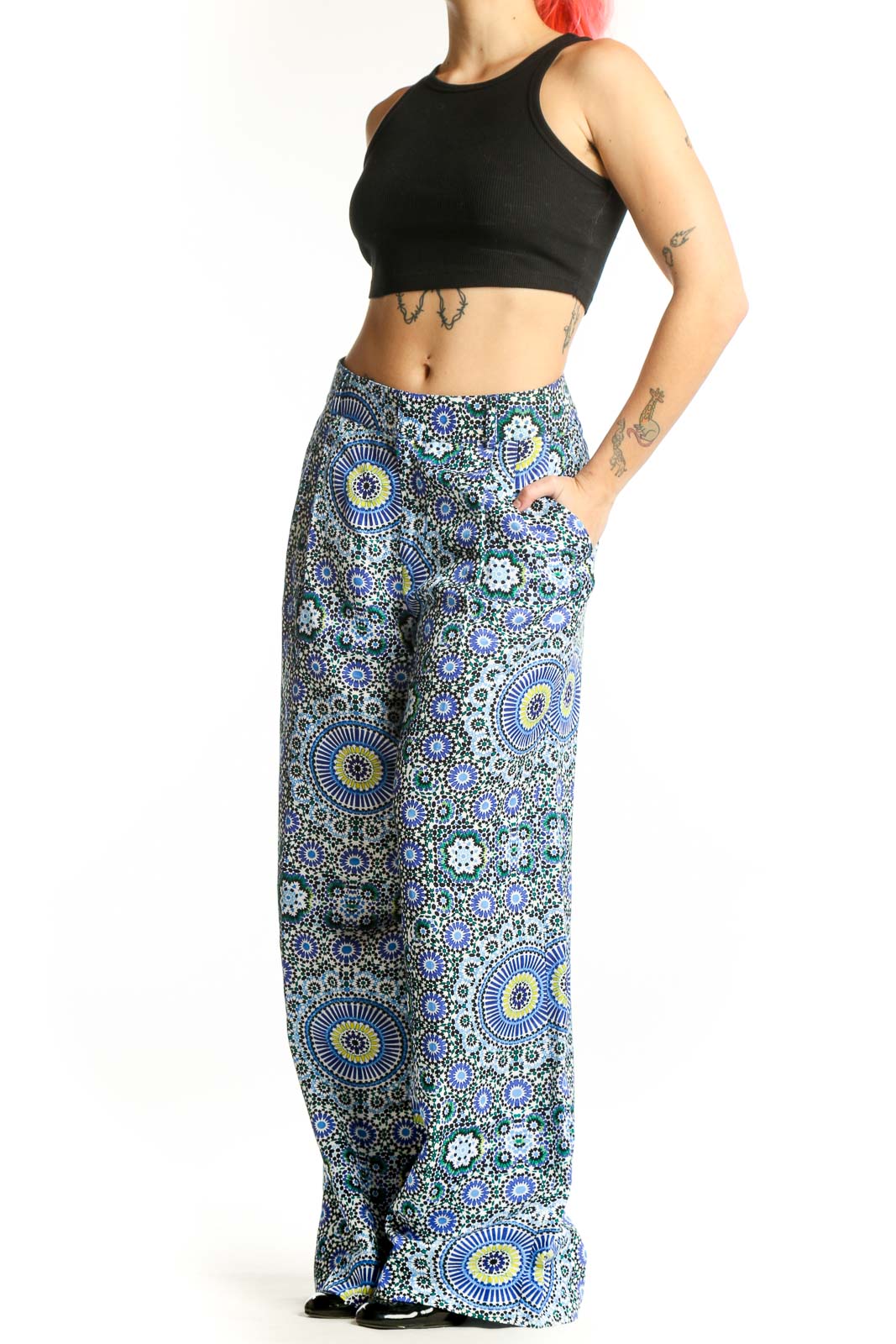 Front view of blue geometric floral wide-leg linen pants with sunburst and circular motifs
