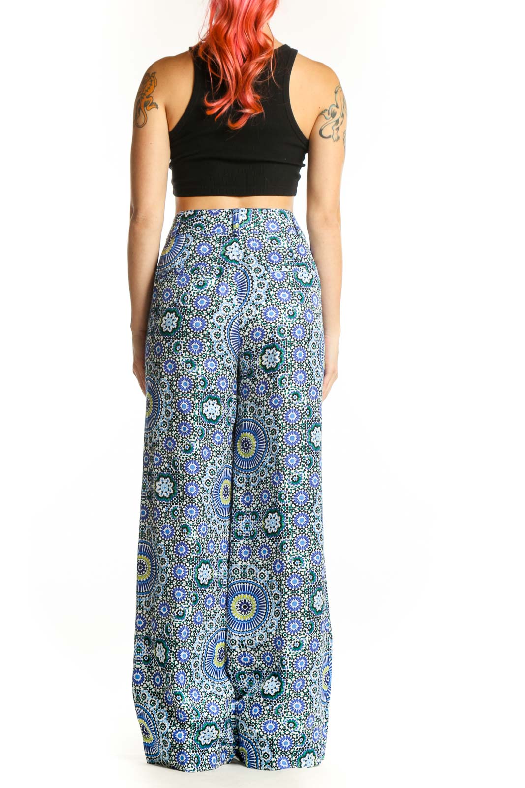 Back view of blue geometric floral wide-leg linen pants showing relaxed fit and side pockets