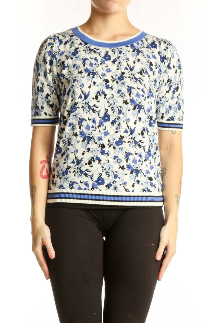 Blue and cream floral print short-sleeve top with striped ribbed neckline and sleeves, front view
