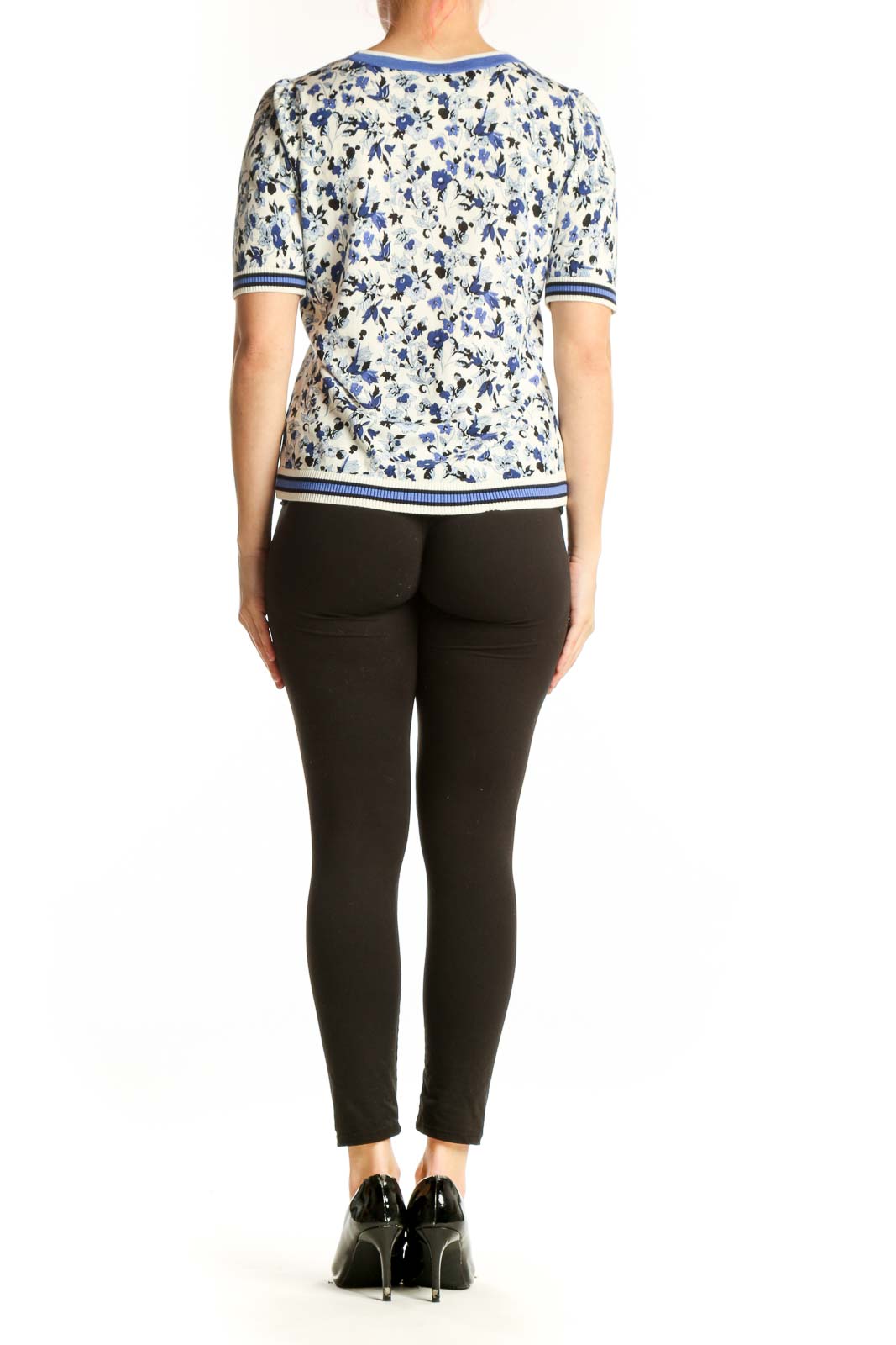 Blue and cream floral print short-sleeve top with striped ribbed trim, back view