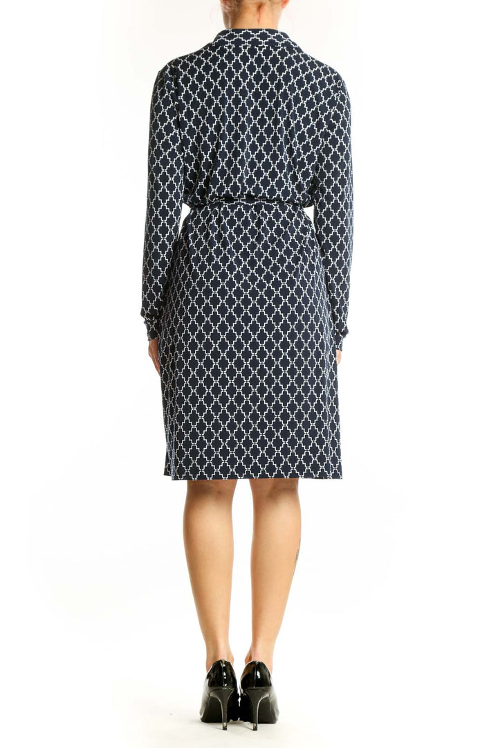 Navy geometric quatrefoil print shirt dress with button-front and belted waist, back view