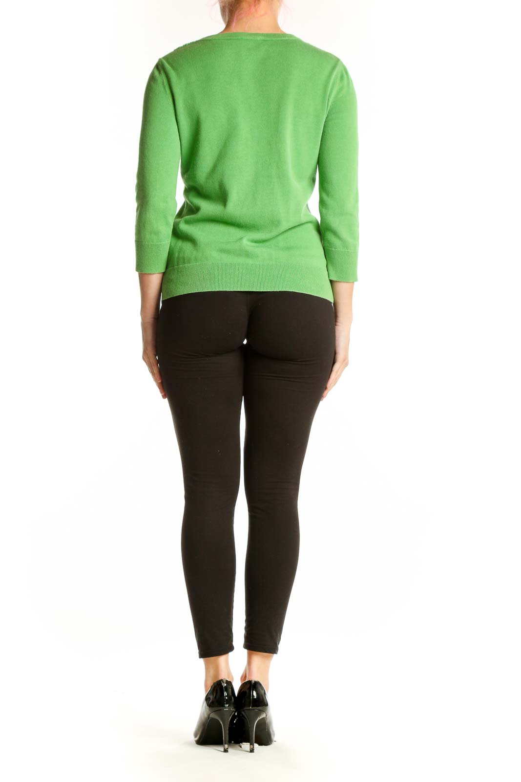 Back view of green cotton-rayon cardigan showing button-front closure and cropped silhouette