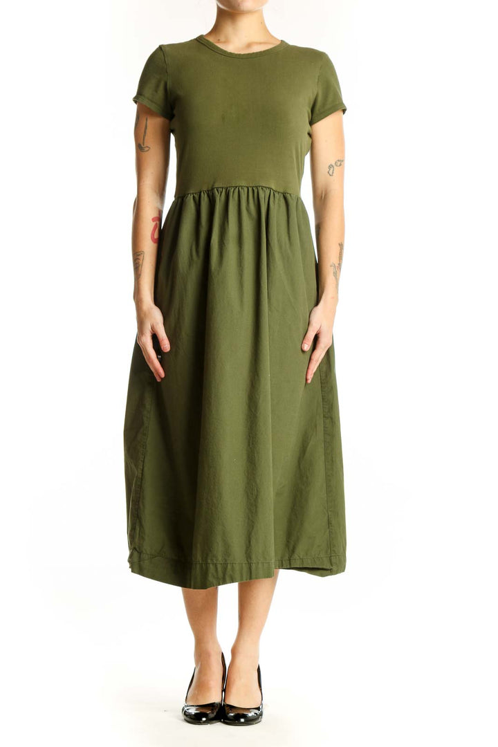 Front view of olive green cotton midi dress with short sleeves and gathered waist