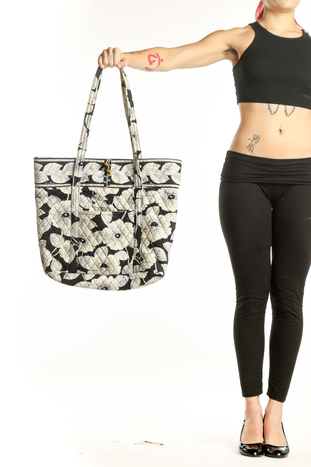 Black and cream floral quilted Vera Bradley tote bag with dual handles, front view