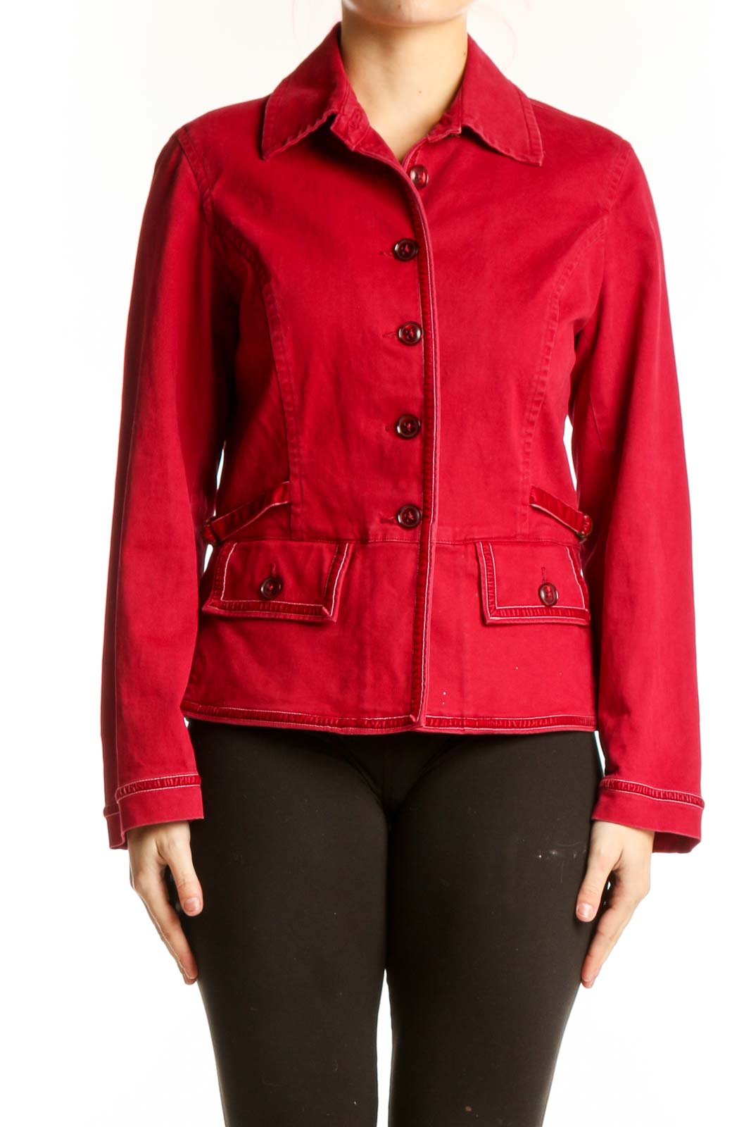 Red cotton-blend button-up jacket with collared neckline, black buttons, and patch pockets, worn with black pants