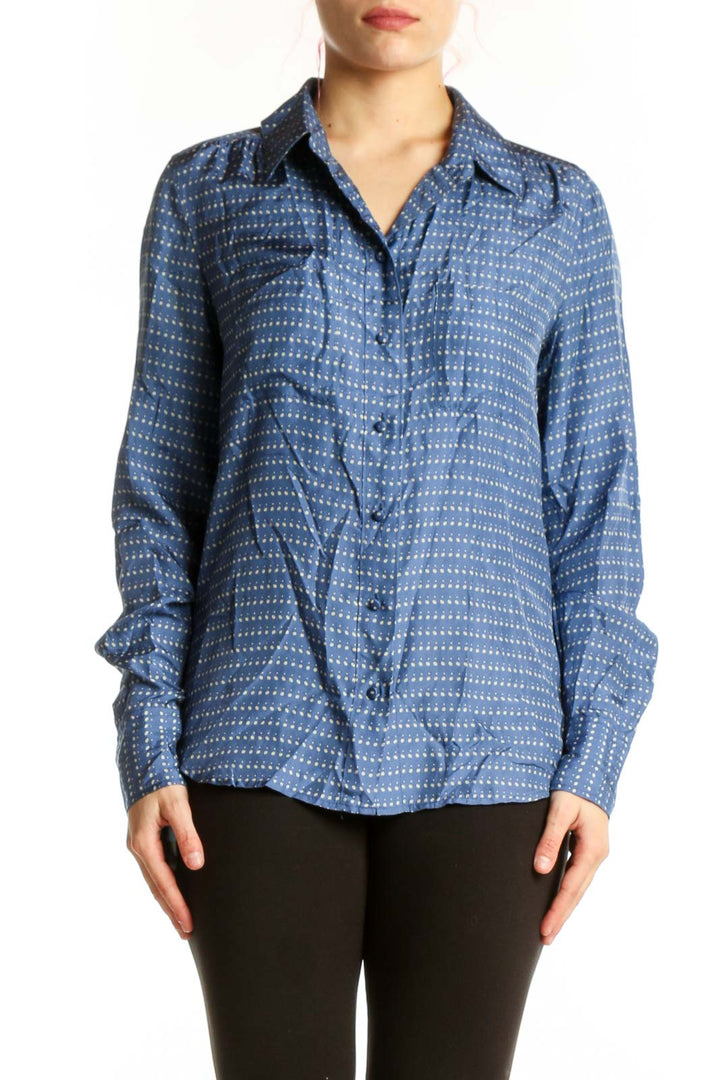 Blue and white dotted J.Crew silk button-up shirt with collar and long sleeves, front view on model