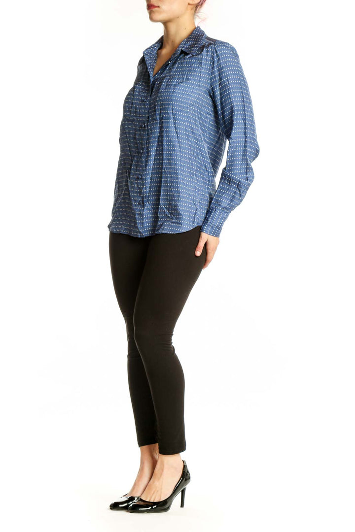 Blue and white dotted J.Crew silk button-up shirt with collar and long sleeves, front view on model