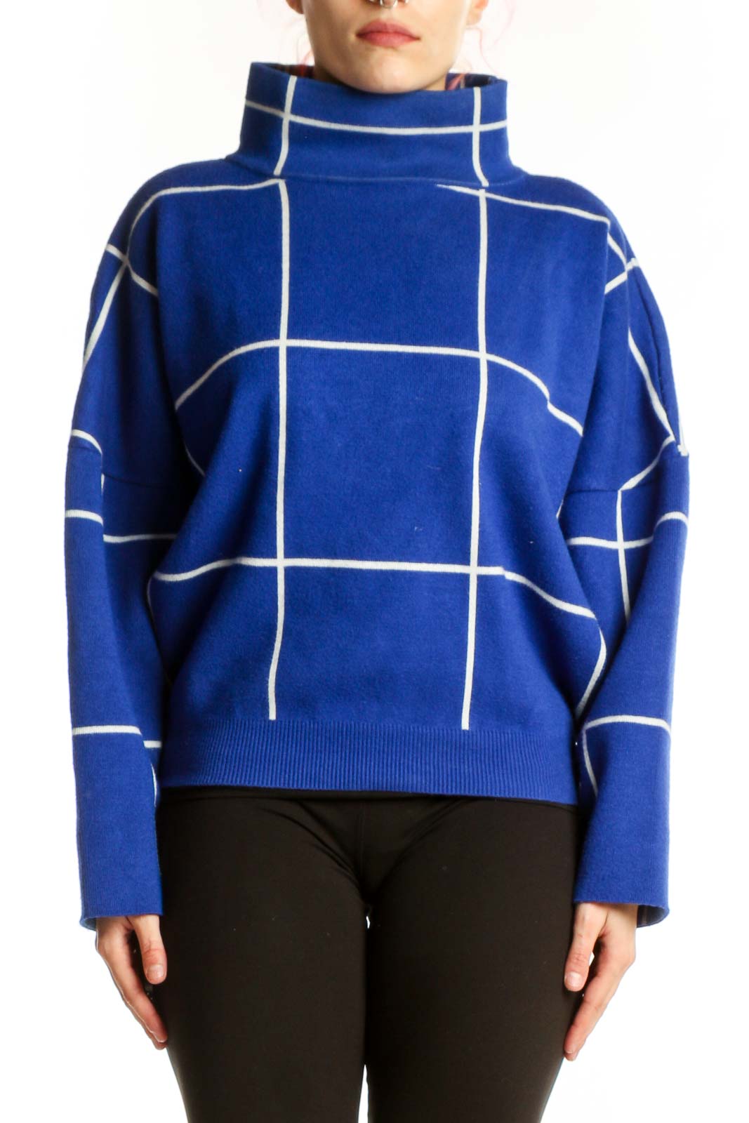 Blue grid turtleneck knit sweater with white geometric pattern, front view