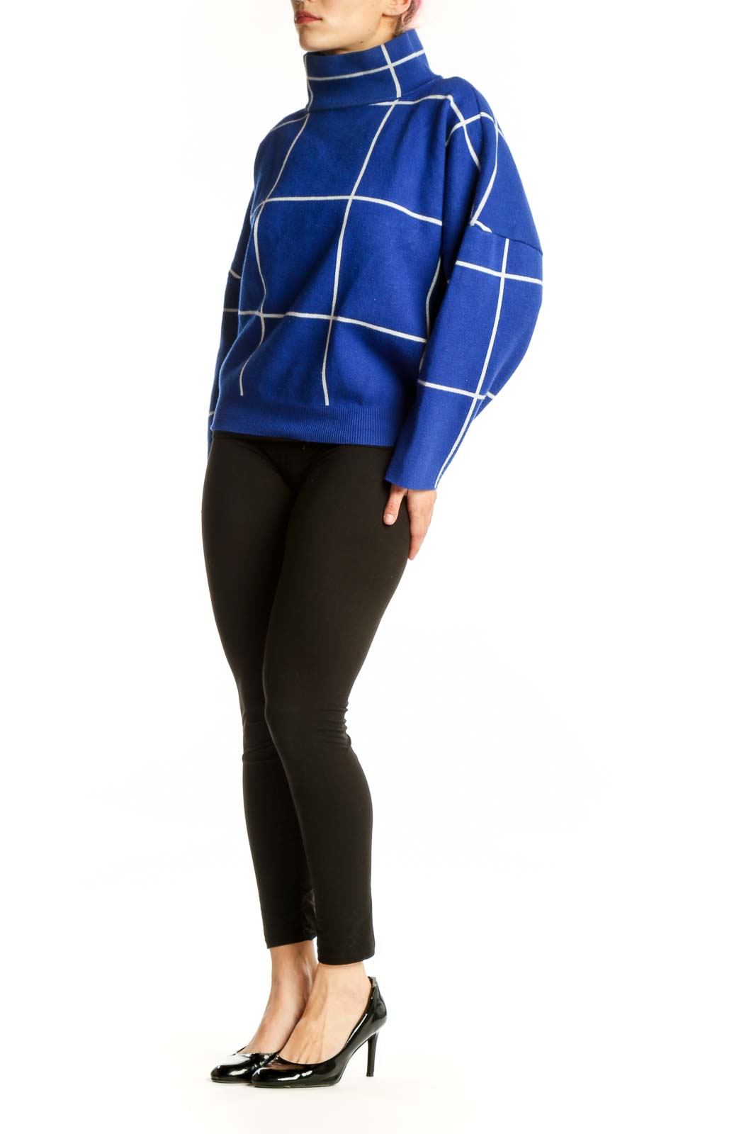 Blue grid turtleneck knit sweater with white geometric pattern, front view