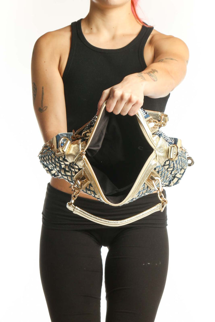 SilkRoll navy geometric satchel bag worn as crossbody style showing side panel weave detail