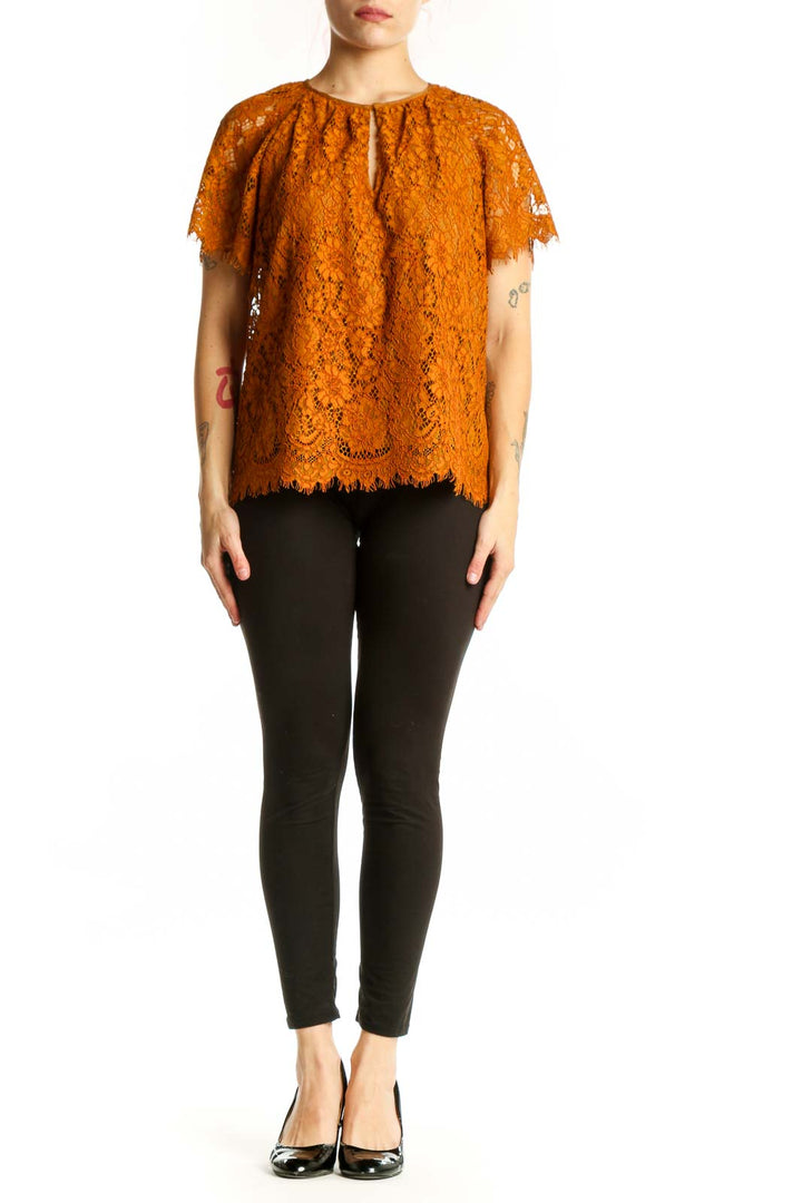 Orange lace short sleeve top with keyhole neckline and scalloped lace edges, front view