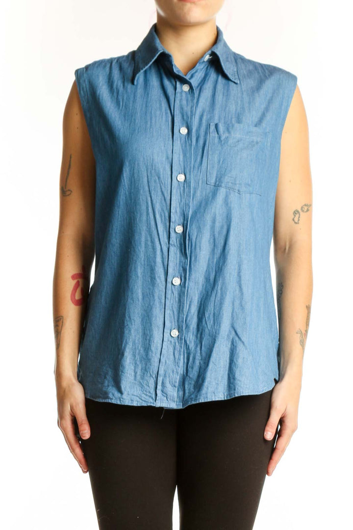 Blue denim sleeveless button-up shirt with collar and chest pocket, front view