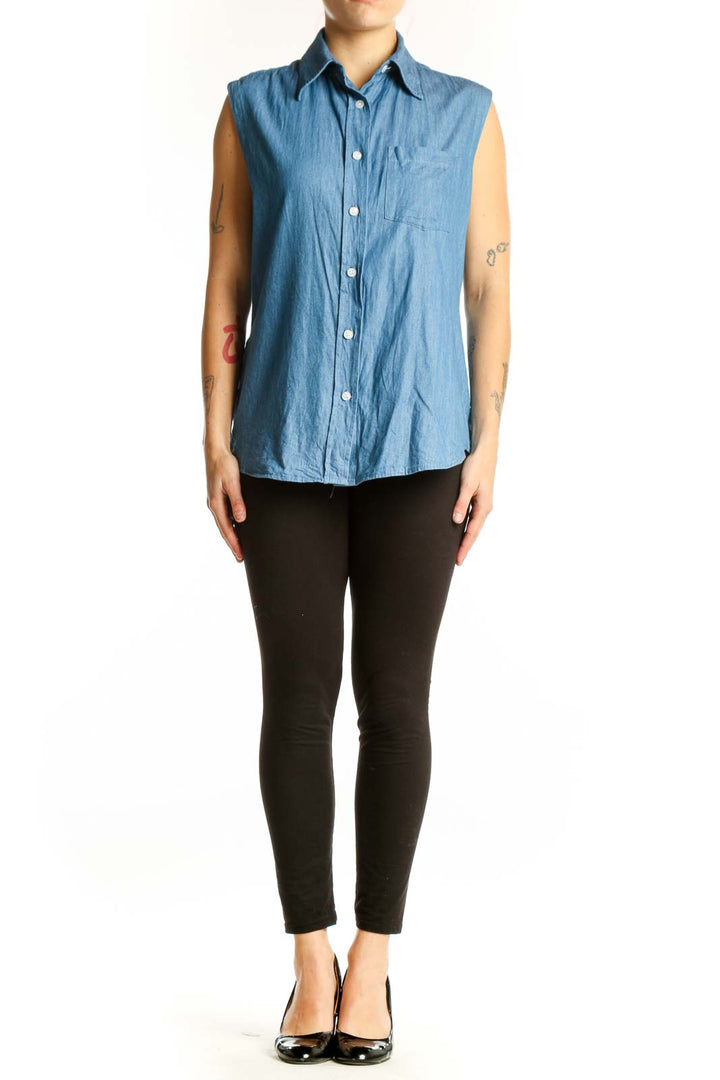 Blue denim sleeveless button-up shirt with collar and chest pocket, front view