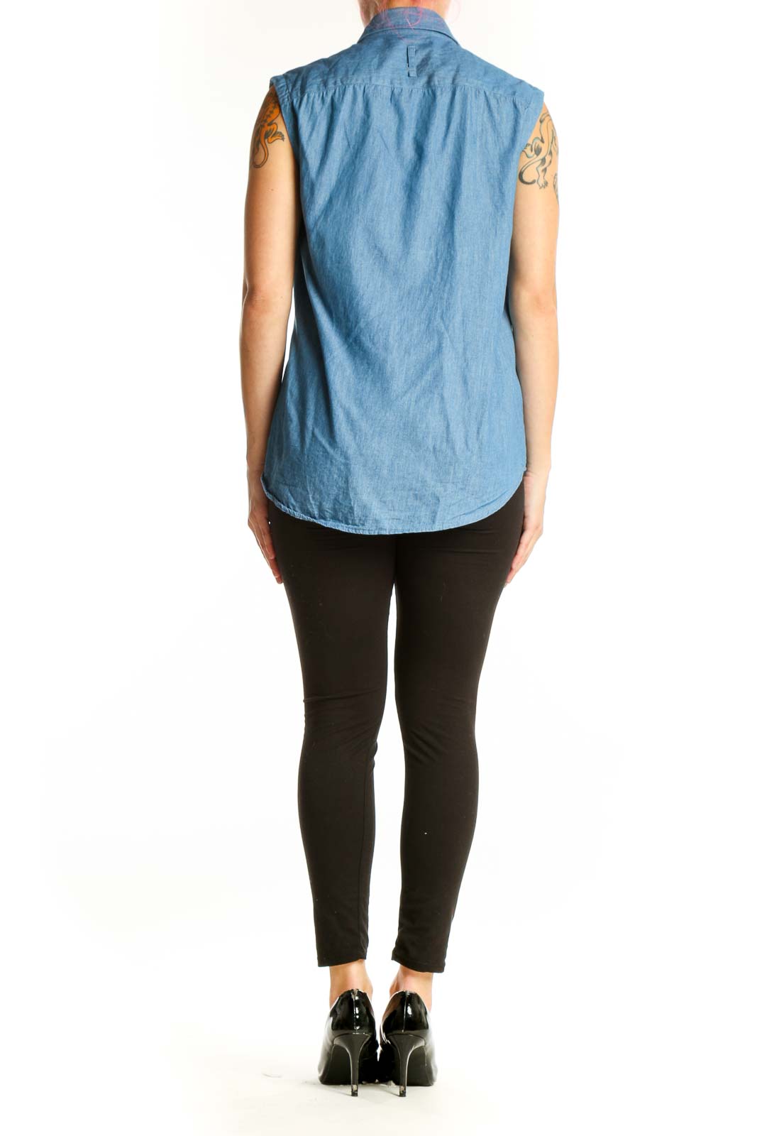 Blue denim sleeveless button-up shirt, back view showing relaxed fit