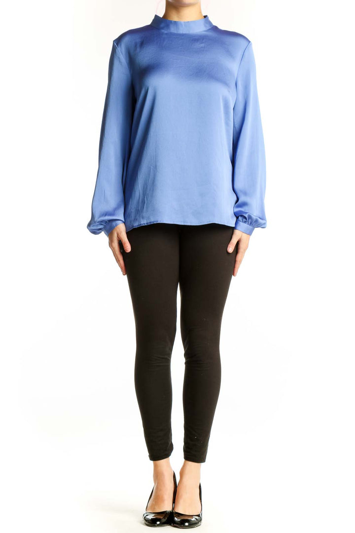 Front view of blue mock neck polyester blouse with long sleeves and gathered cuffs