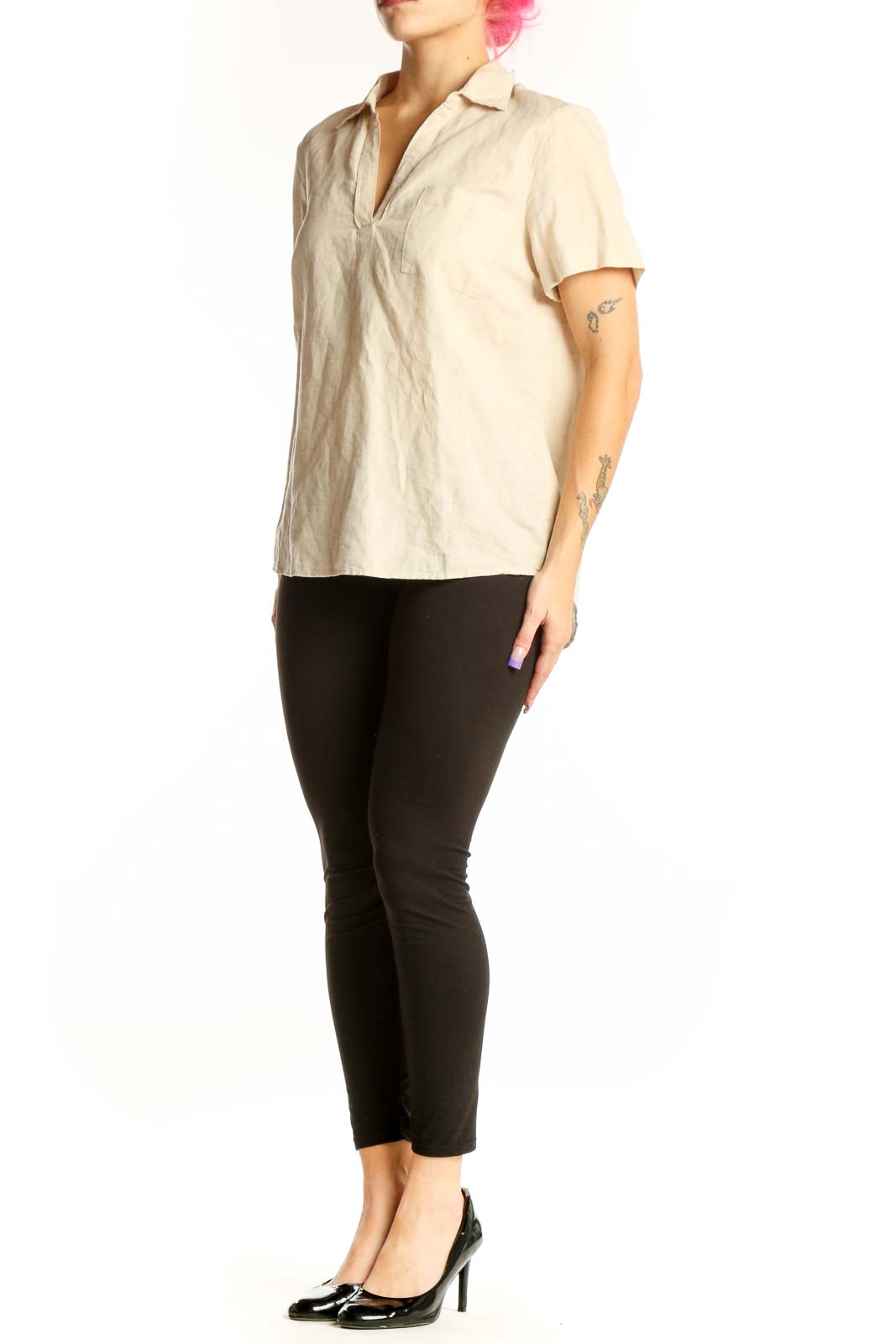 Front view of cream linen short sleeve polo top with collared neckline and chest pocket detail