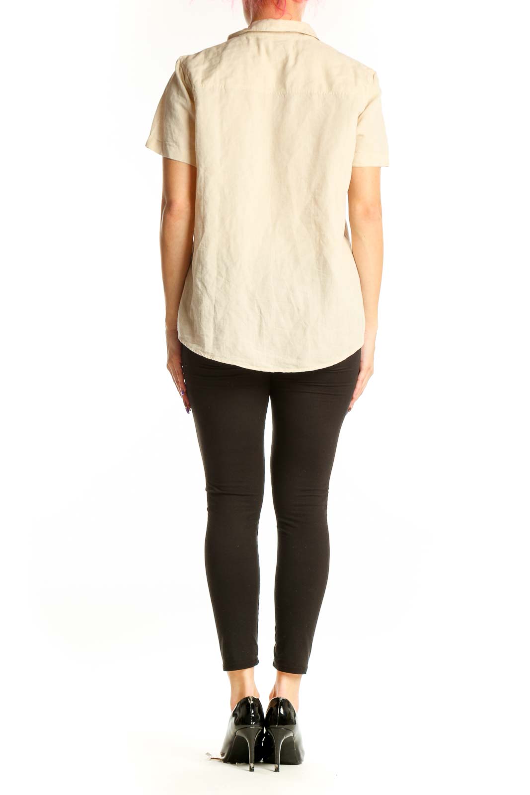 Back view of cream linen polo top showing clean, minimalist design and straight-cut fit