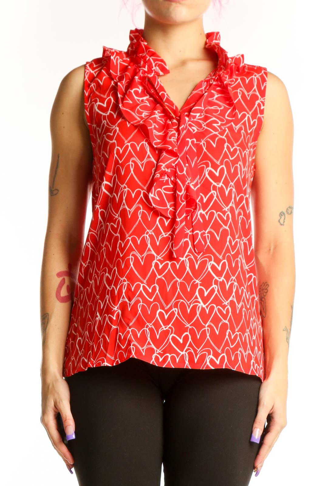 Red sleeveless top with white heart print and ruffle collar detail, front view