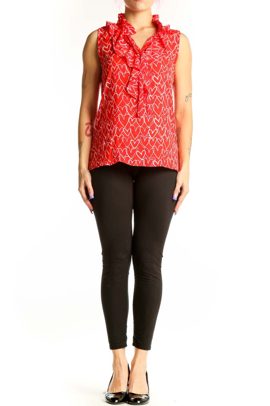 Red sleeveless top with white heart print and ruffle collar detail, front view