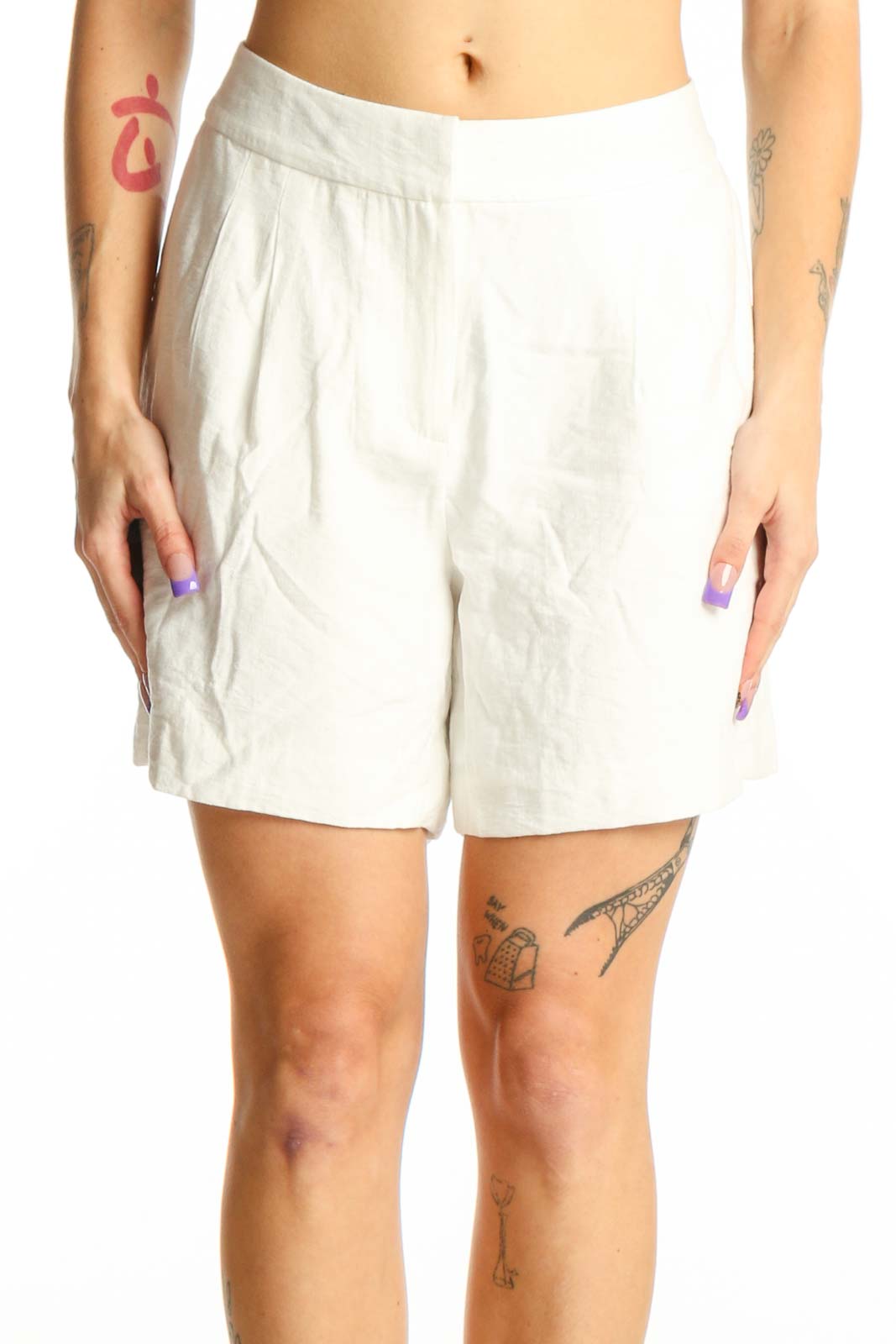 Cream pleated high-waist shorts by Vince Camuto, front view showing tailored fit and pleated design