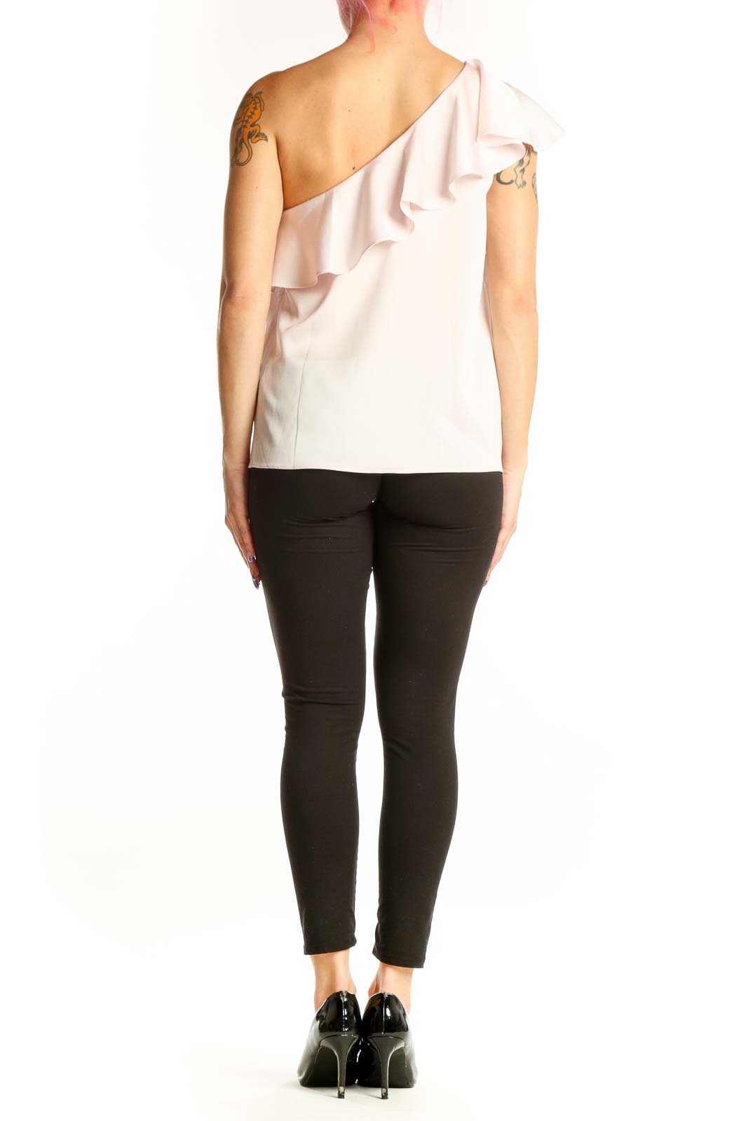 Back view of cream one-shoulder ruffle polyester top showing elegant drape and ruffle design