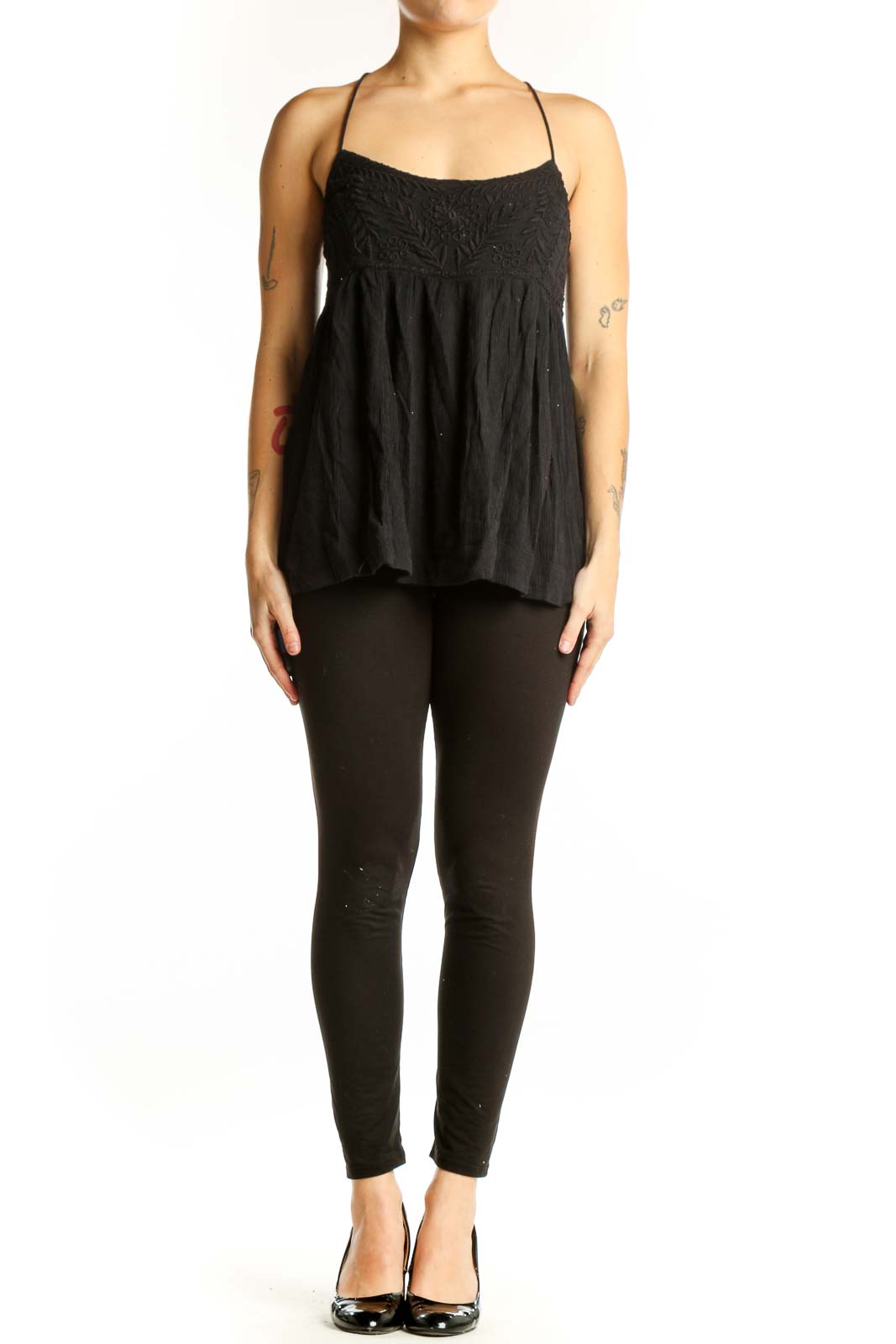 Free People black embroidered camisole tank top with empire waist and spaghetti straps, front view