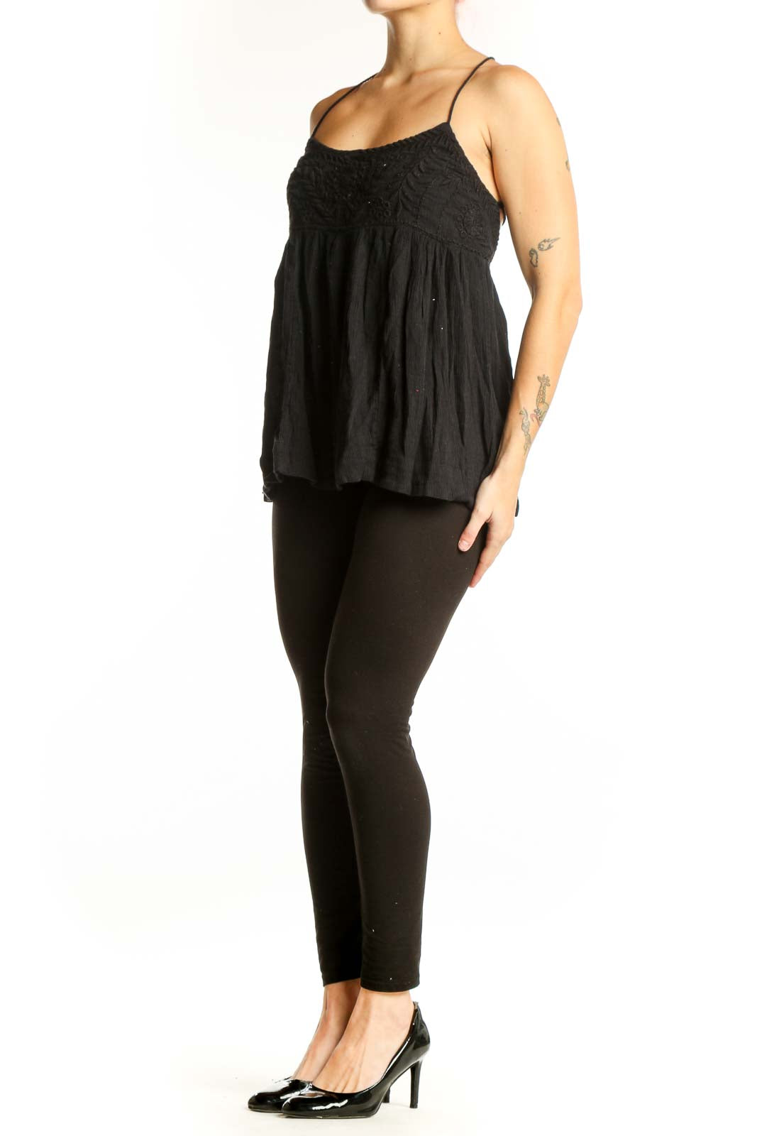 Free People black embroidered camisole tank top with empire waist and spaghetti straps, front view