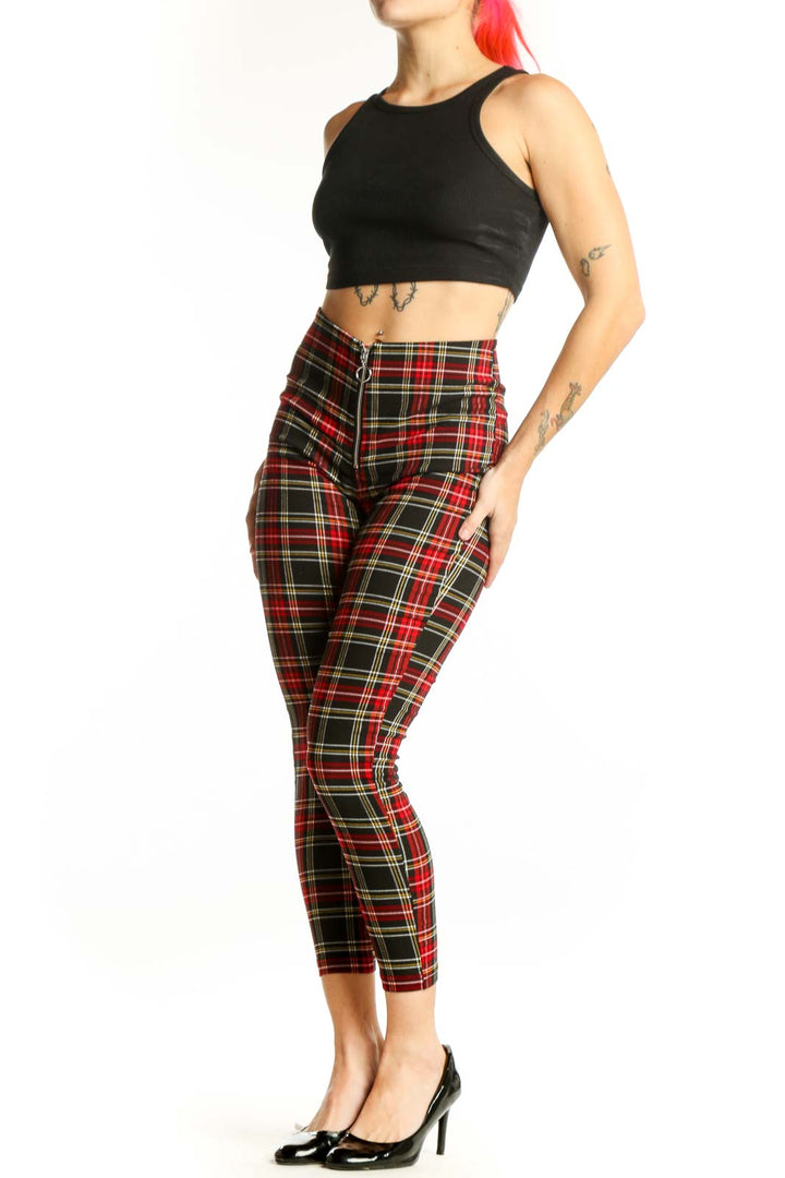 Red tartan plaid cropped pants with high-waisted design and zip fly closure, front view