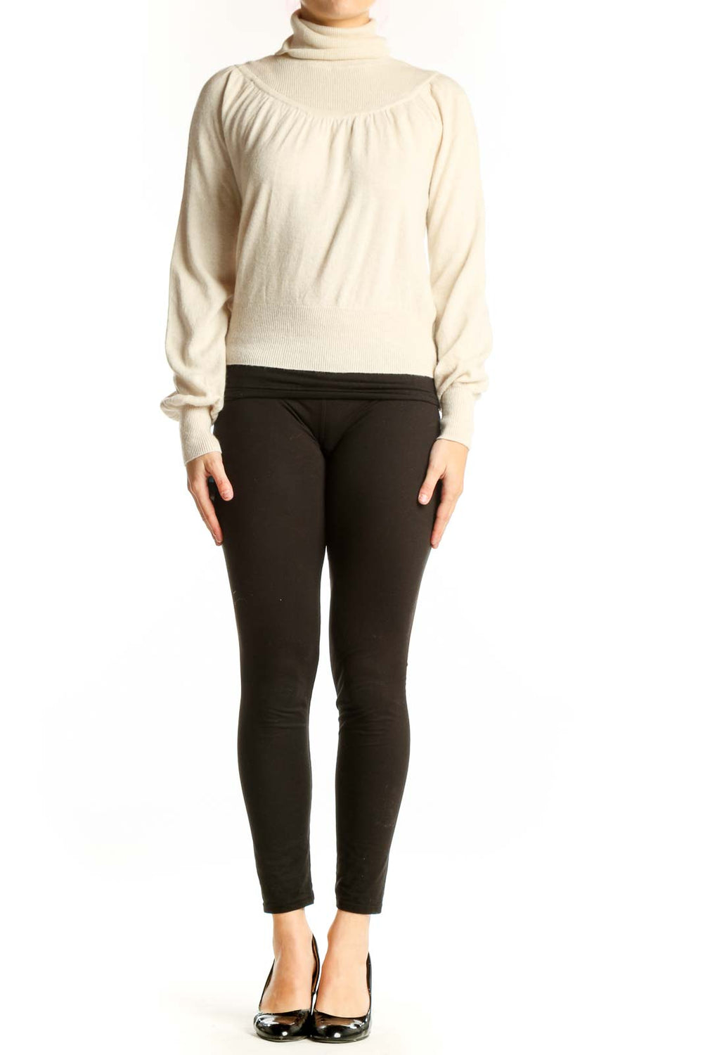 Cream turtleneck pullover sweater with gathered shoulders and cropped fit, front view