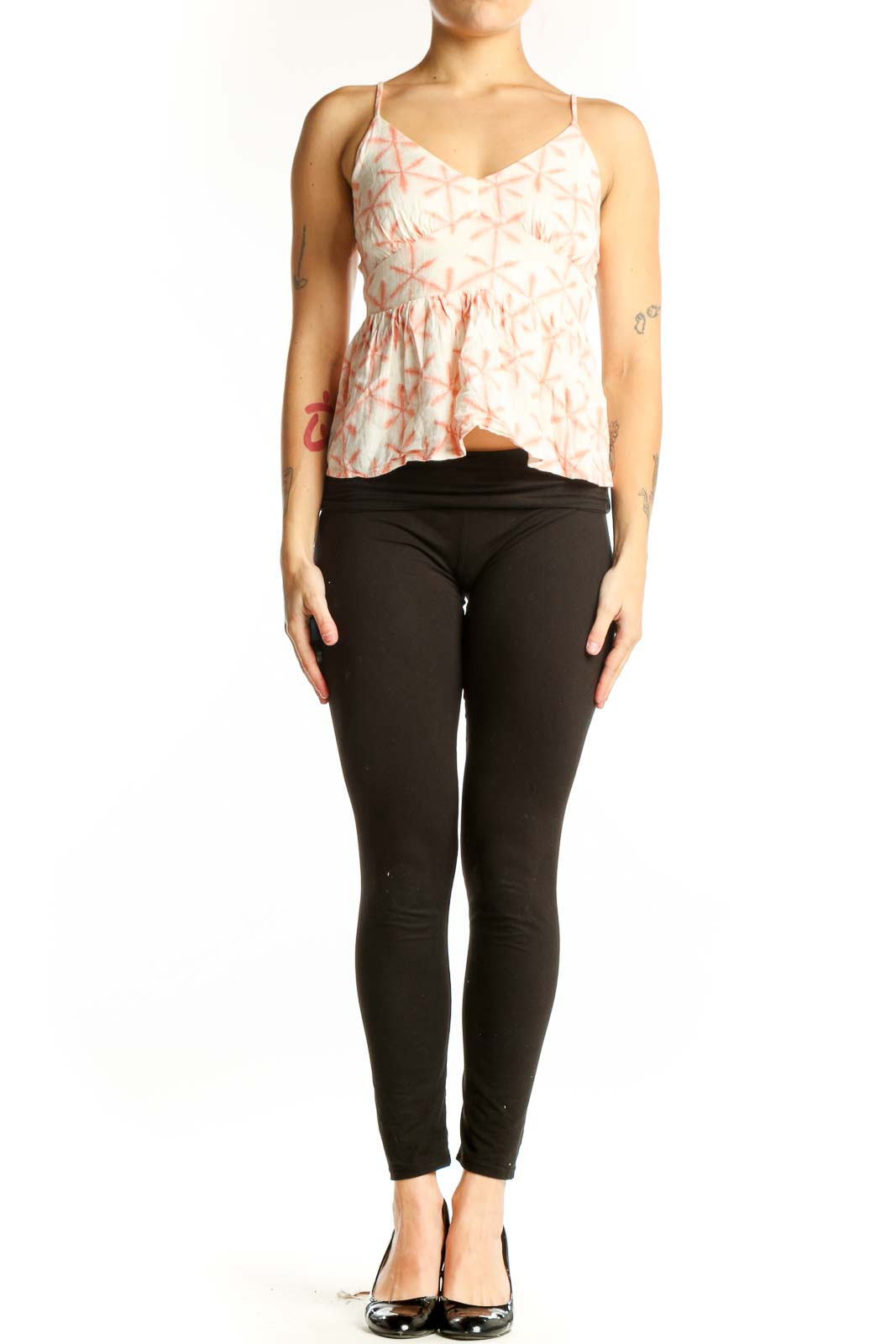 Cream and coral geometric print LOFT camisole top with V-neckline and peplum hem, front view on model