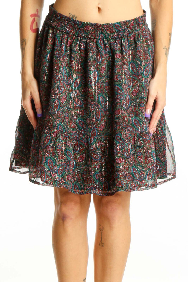 Front view of multicolor paisley pleated skater skirt by LOFT, size S, featuring vibrant burgundy, teal, and gold paisley pattern with elastic waistband