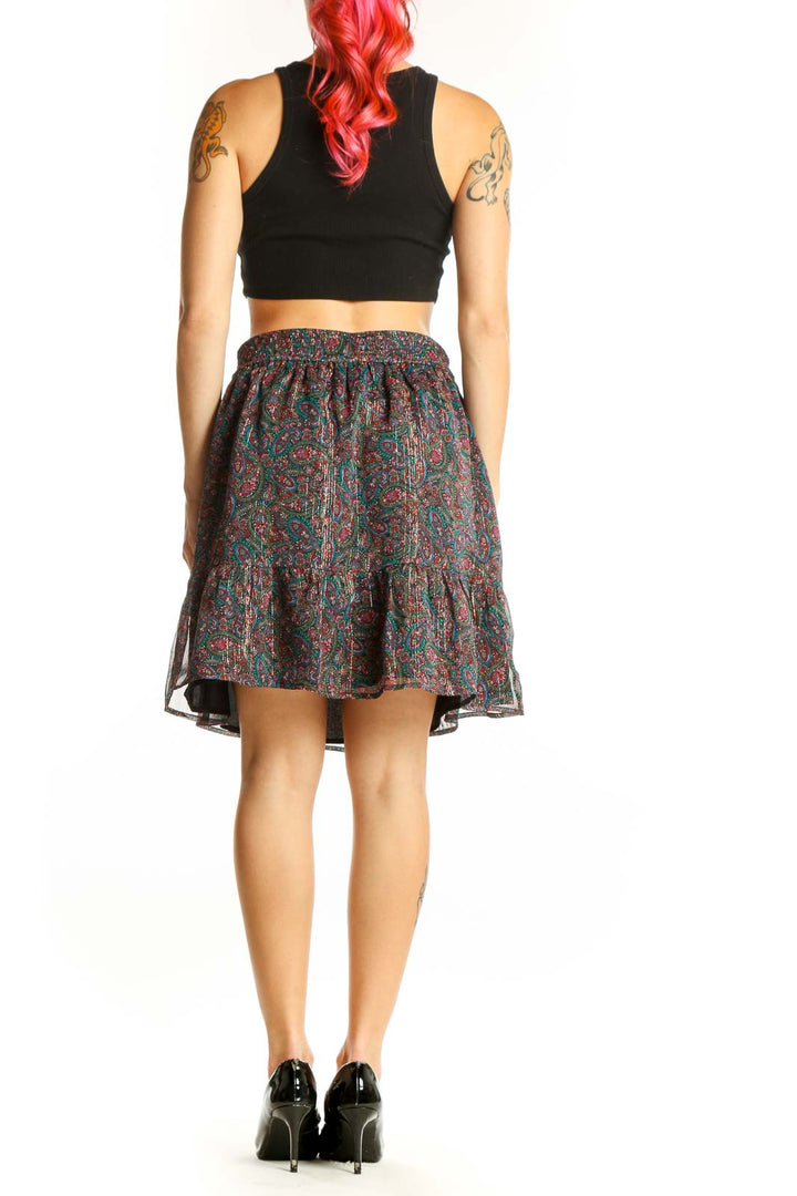 Back view of multicolor paisley pleated skater skirt by LOFT, showing the full A-line silhouette and pleated construction with knee-length cut
