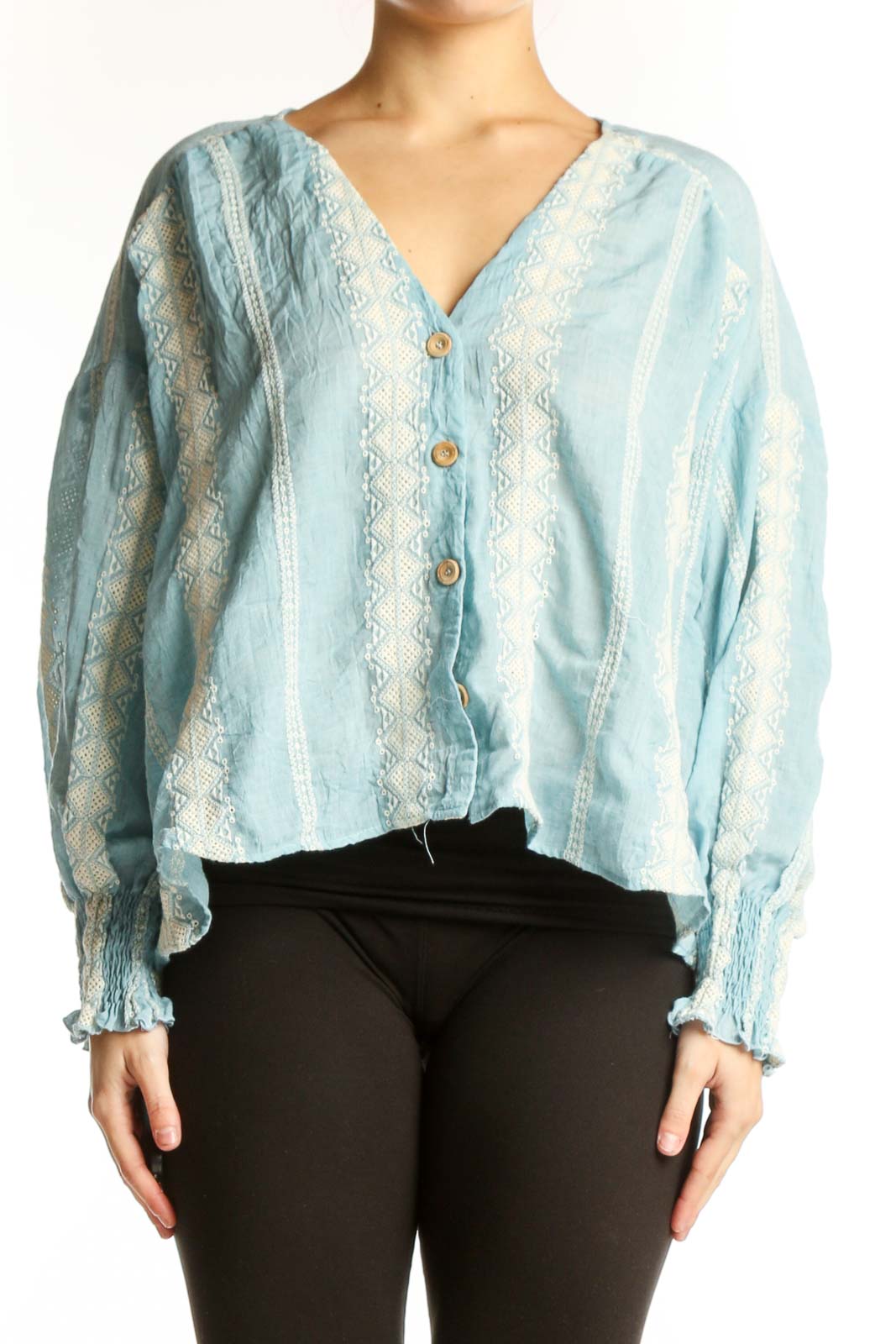 Light blue lace button-up cropped blouse with puffed sleeves and cream lace detailing, front view