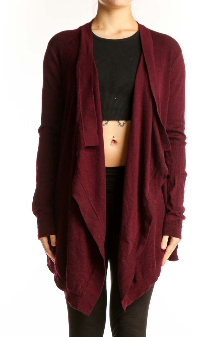 Burgundy merino wool open front cardigan by Theory, worn over black top, showing relaxed drape and long sleeves