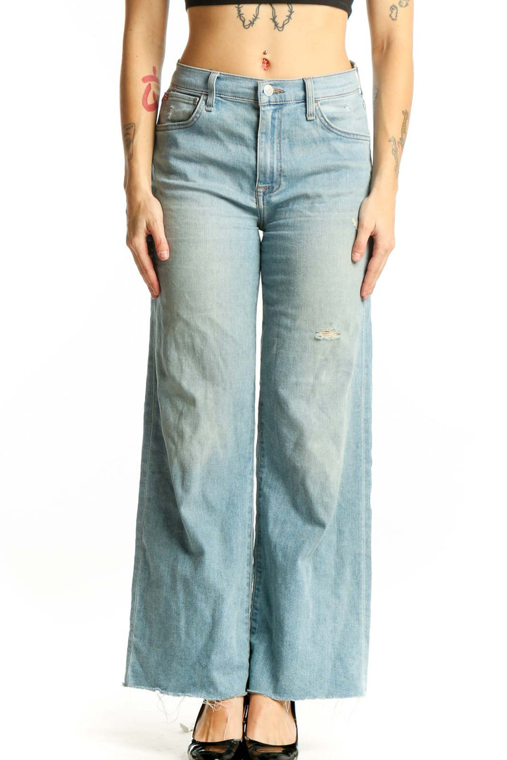 Light blue distressed Hudson Jeans wide-leg denim with cropped hem, front view on model