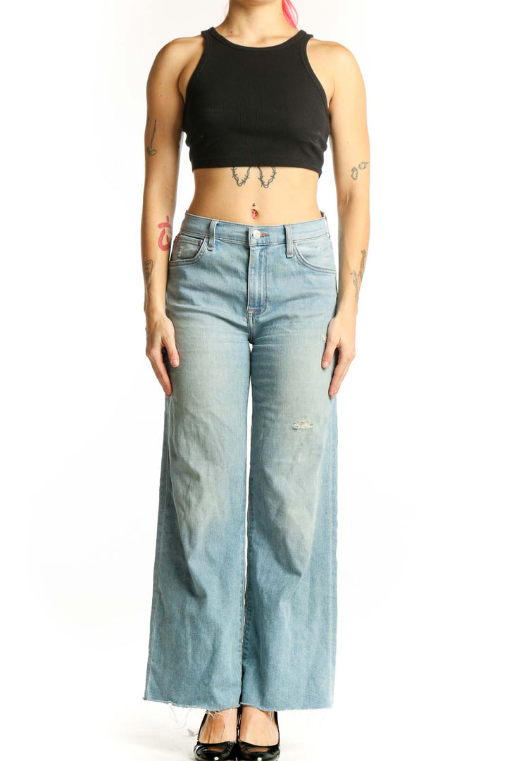 Light blue distressed Hudson Jeans wide-leg denim with cropped hem, front view on model