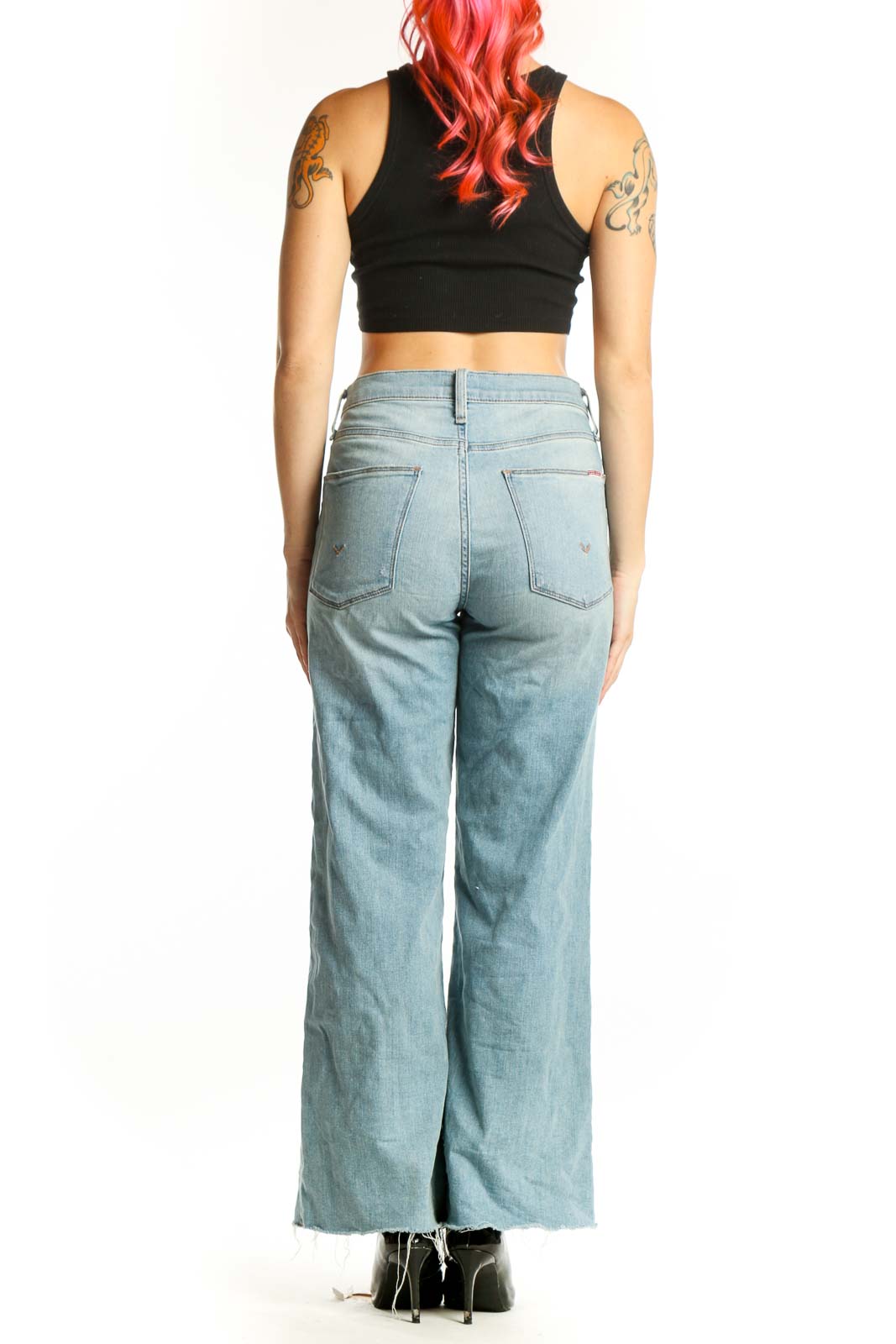 Light blue distressed Hudson Jeans wide-leg denim with cropped hem, back view on model