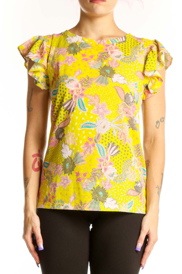 Yellow floral LOFT top with ruffle cap sleeves and botanical print, front view on model