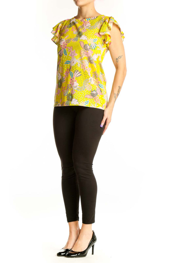 Yellow floral LOFT top with ruffle cap sleeves and botanical print, front view on model