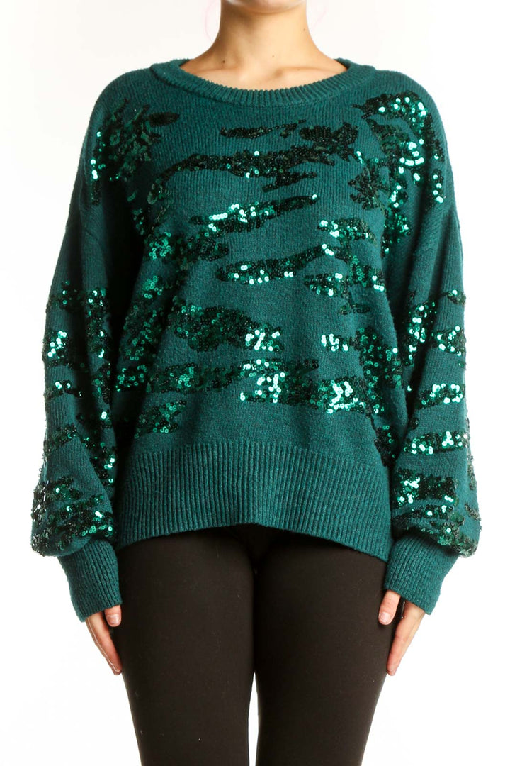 Teal Nine West pullover sweater with black and silver sequin embellishments, front view on model