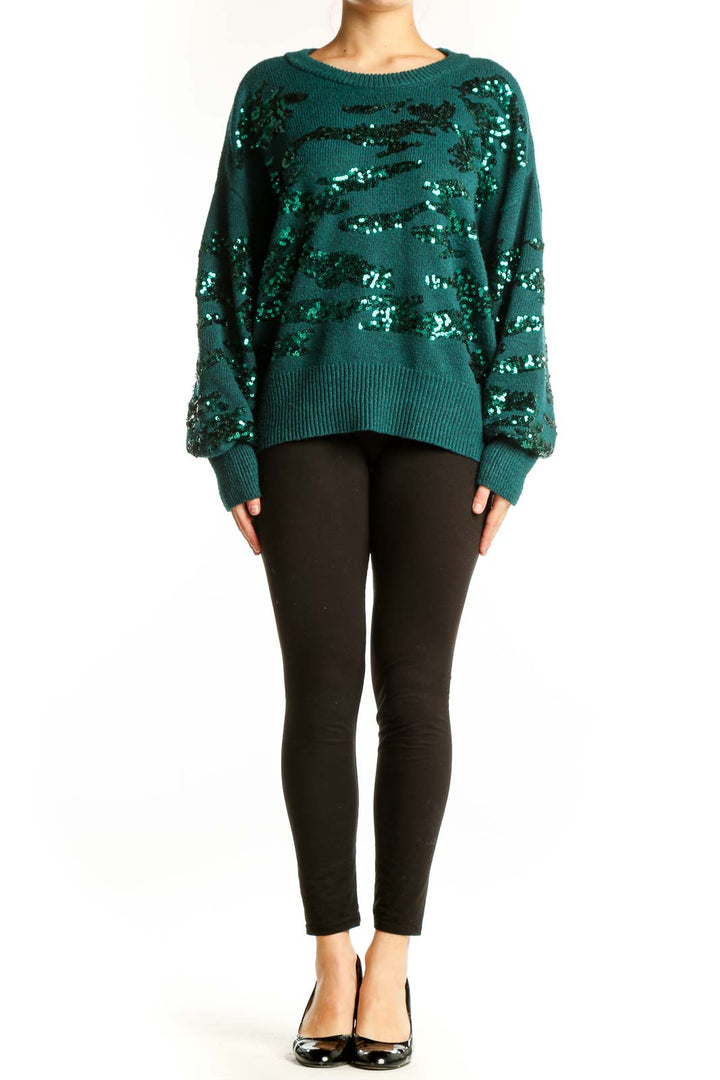 Teal Nine West pullover sweater with black and silver sequin embellishments, front view on model