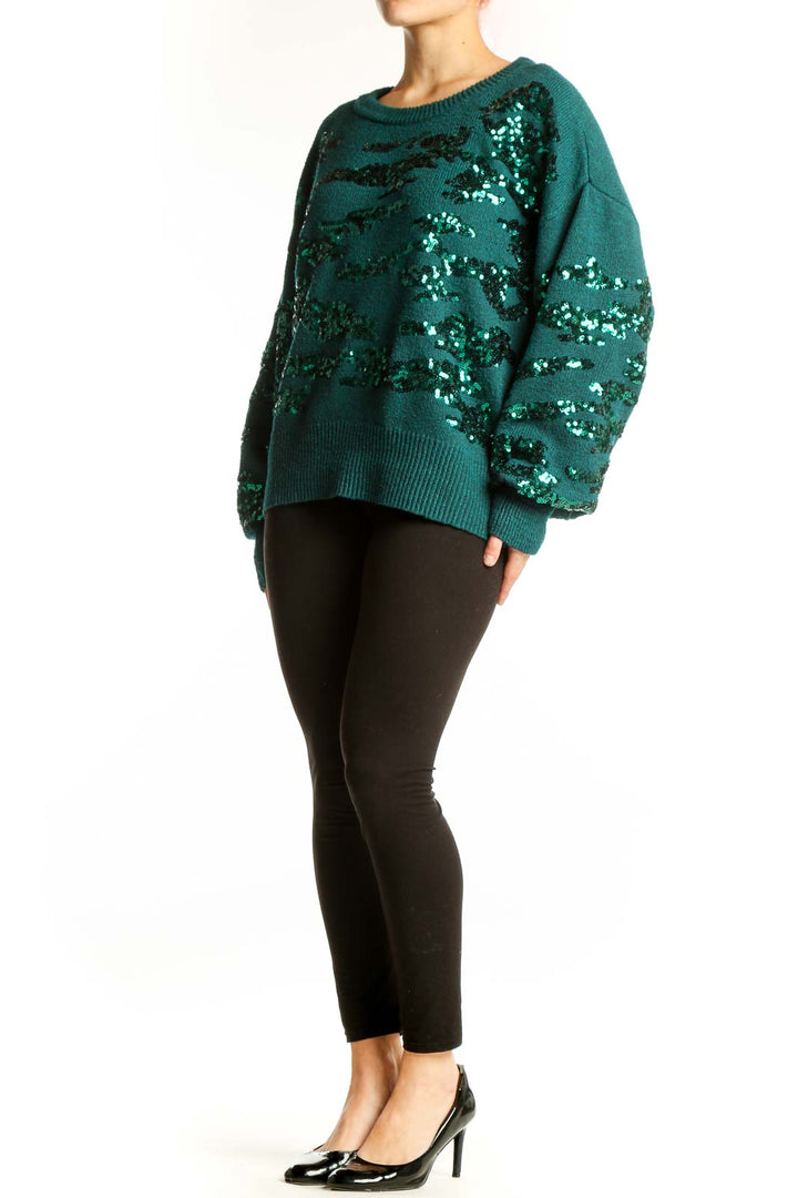Teal Nine West pullover sweater with black and silver sequin embellishments, front view on model