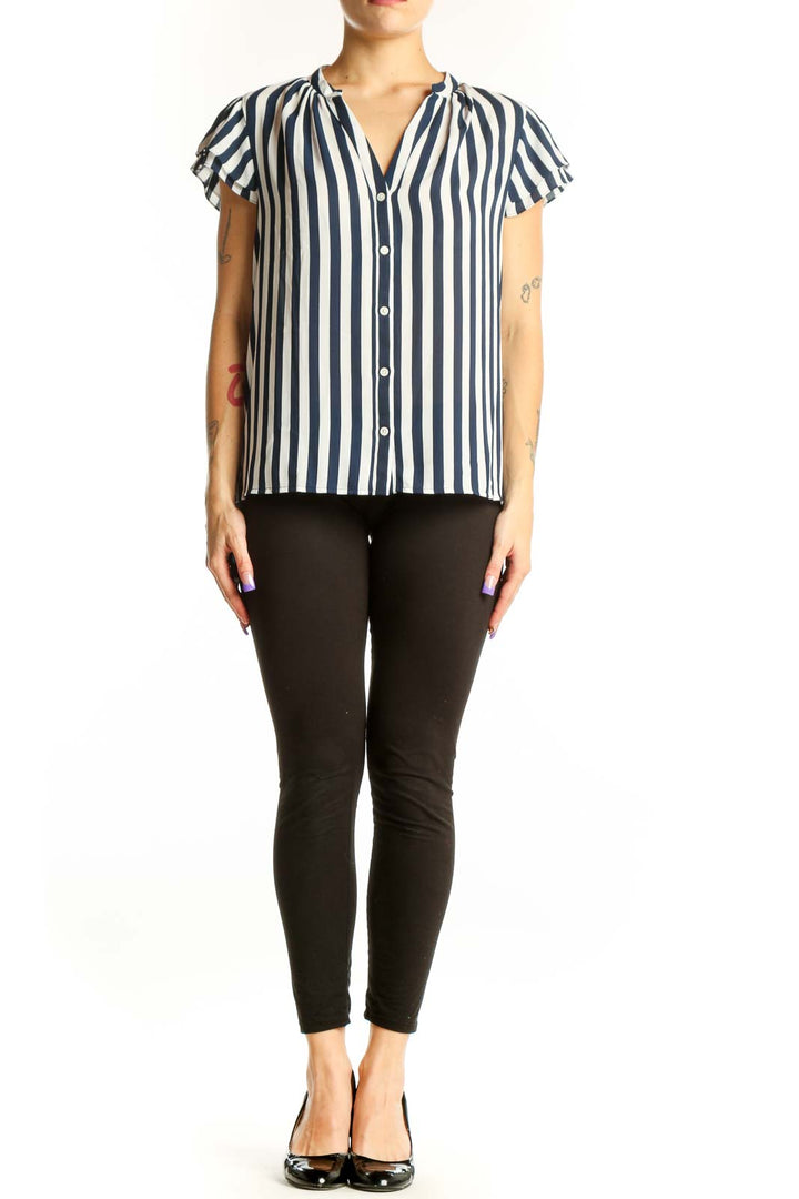 Navy and white striped short-sleeve button-up top with ruffled cap sleeves and V-neckline, front view