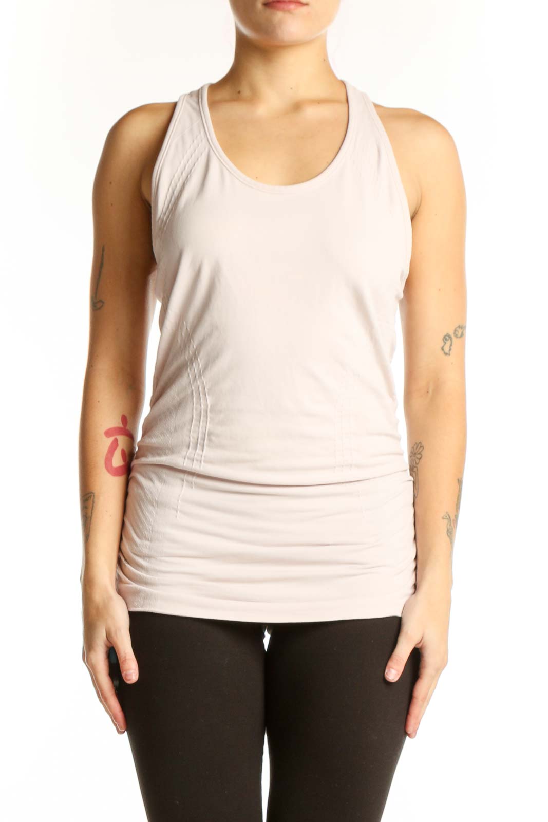 Cream Athleta racerback tank top with ruched side detailing, front view on model