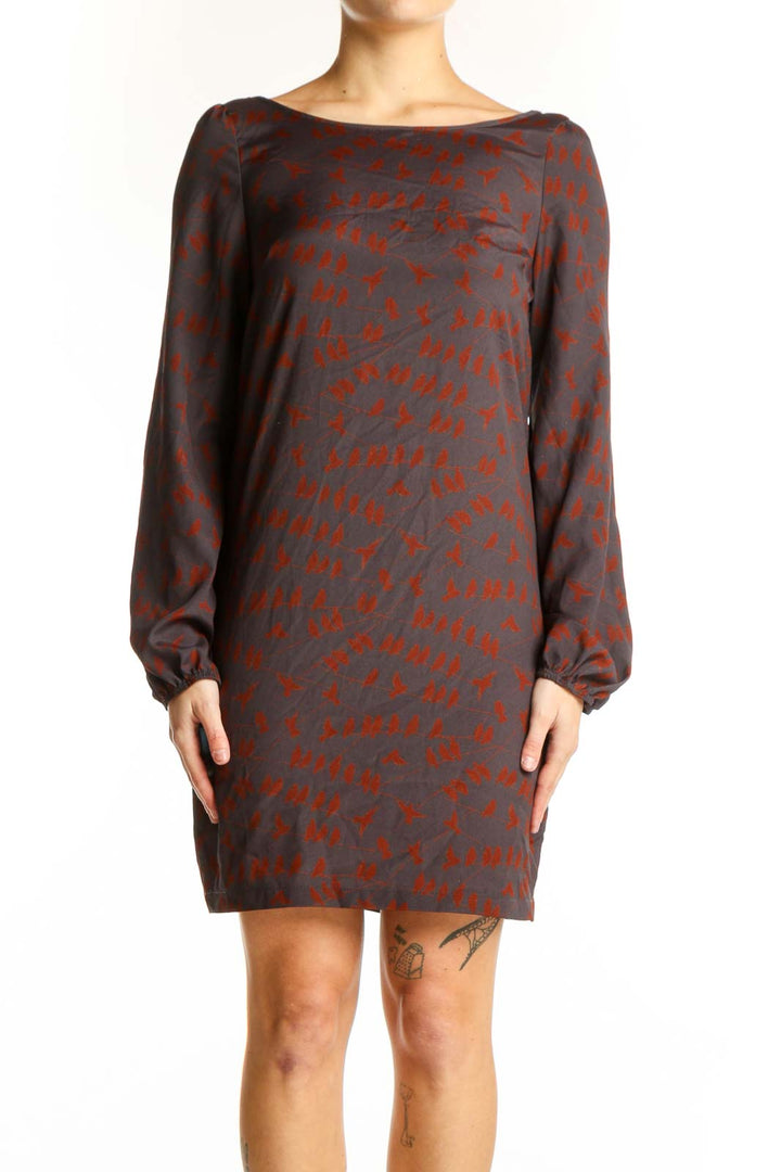 Red abstract print long sleeve dress with charcoal base, boat neckline, and knee-length silhouette