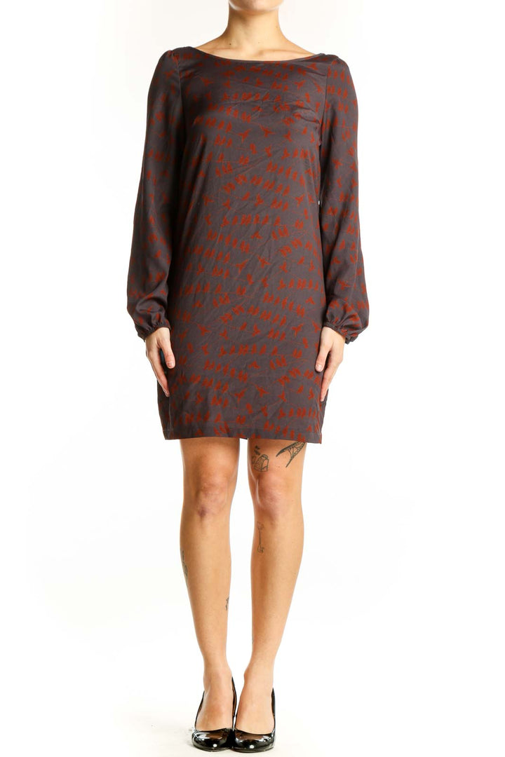 Red abstract print long sleeve dress with charcoal base, boat neckline, and knee-length silhouette