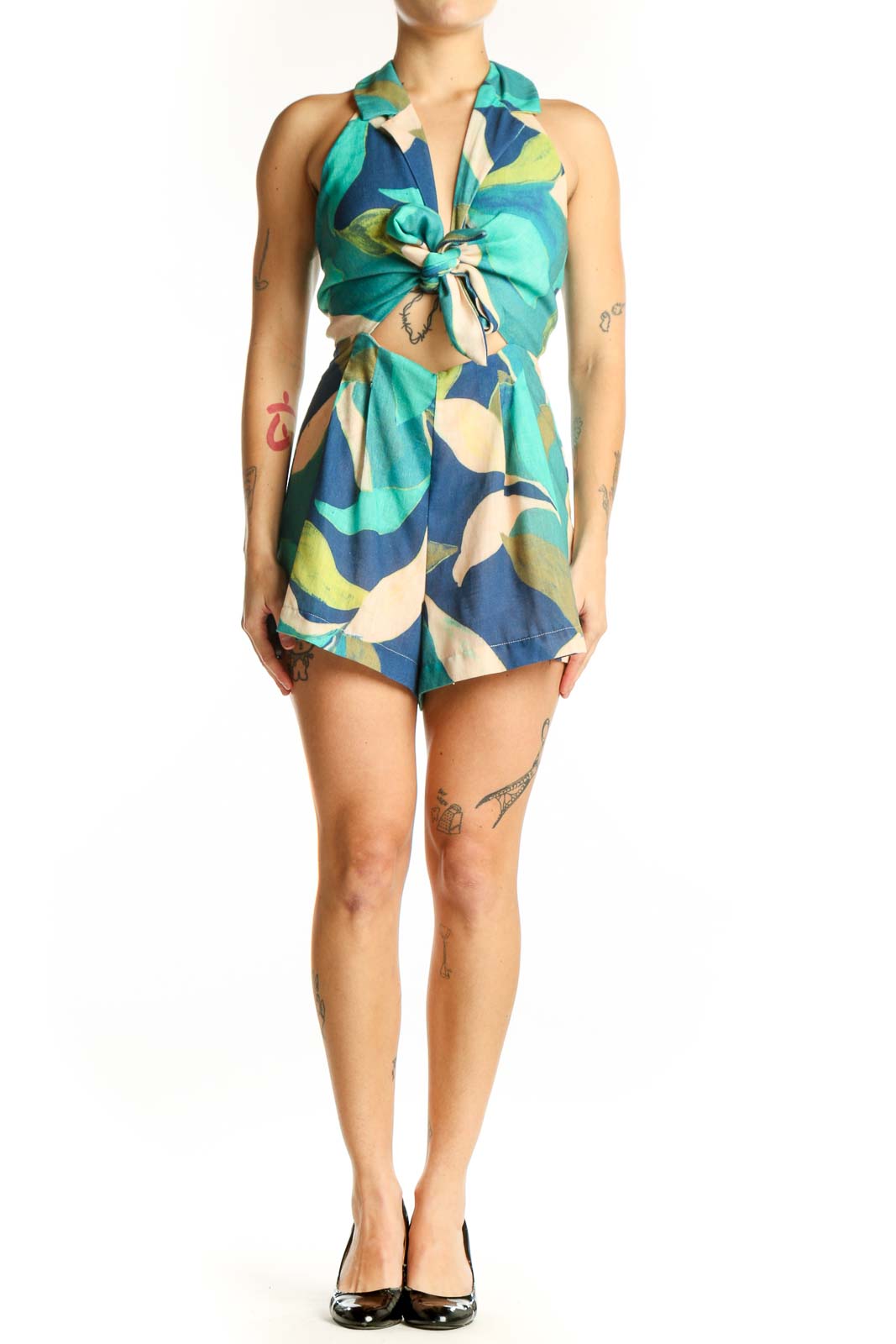 Teal and navy abstract floral halter tie romper with cropped midriff and A-line skirt, front view