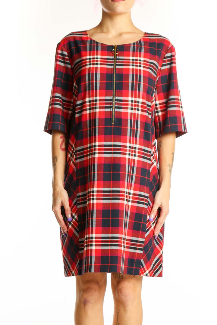 Red, navy, and white plaid shift dress with front zip closure and half-length sleeves