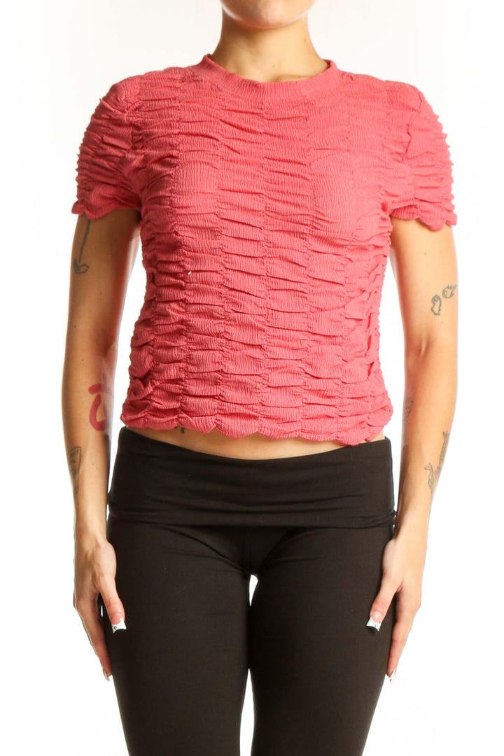 Front view of pink textured crop top by House of Harlow 1960